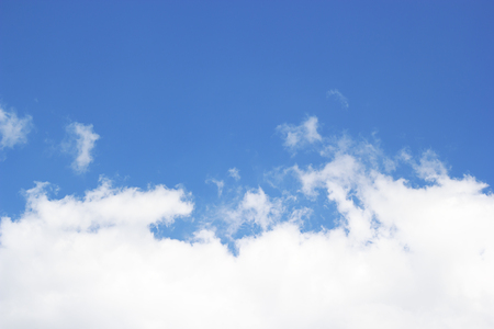 Blue sky background and white clouds soft focus, and empty space.の写真素材
