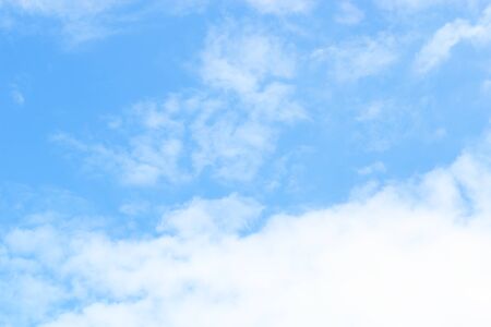 Blue sky background and white clouds soft focus, beautiful of nature.の写真素材