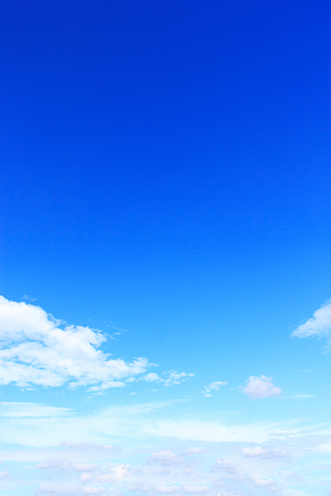 Blue sky and soft white clounds and empty space for your design.の写真素材