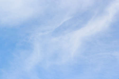 Soft white clouds against blue sky background and empty space.の写真素材