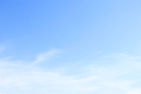 Soft white clouds against blue sky background and empty space for your design.の写真素材