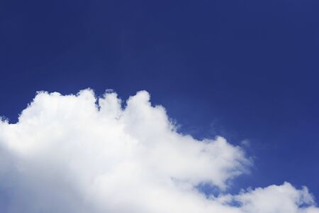 Blue sky background and white clouds soft focus, and empty space.の写真素材