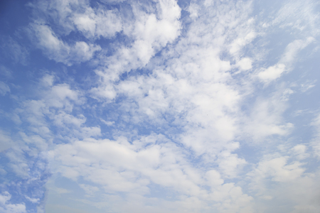 Blue sky and soft white clounds and empty space for your design.の写真素材
