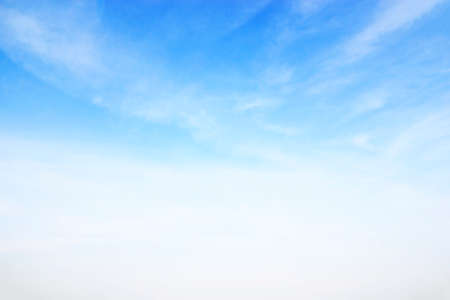 Soft white clouds against blue sky background and empty space for your design, beautiful of nature.の写真素材