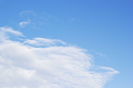 Blue sky background and white clouds soft focus, and empty space.の写真素材