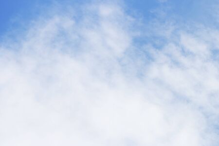Soft white clouds against blue sky background and empty space.の写真素材