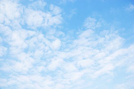 Blue sky background and white clouds soft focus.の写真素材