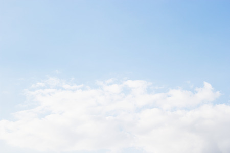 Blue sky background and white clouds soft focus, and empty space.の写真素材