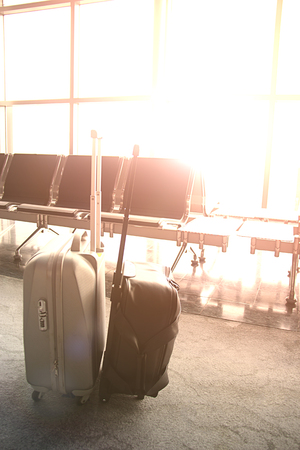 Luggage in the airport and sun light with and copy-space no body.の写真素材