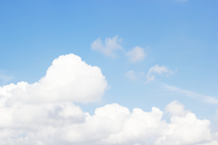 Soft white clouds against blue sky background and copy space.の写真素材