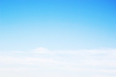 Blue sky background and white clouds soft focus, and empty space.の写真素材