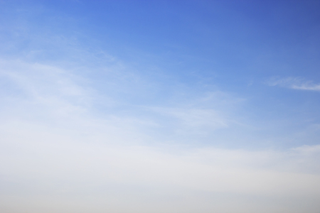 Soft white clouds against blue sky background and empty space.の写真素材