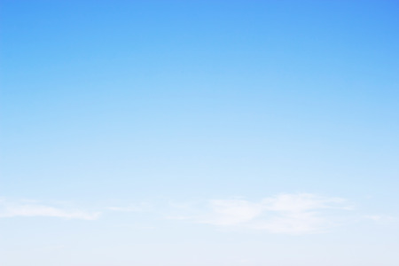 Blue sky background and white clouds soft focus, and empty space.の写真素材