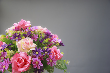 Pink rose bouquet isolated on gray background, soft focus.の写真素材