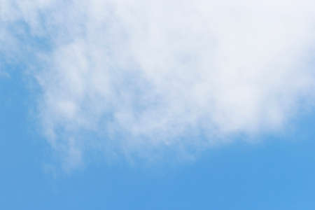 Blue sky background and white clouds soft focus, beautiful of nature.の写真素材