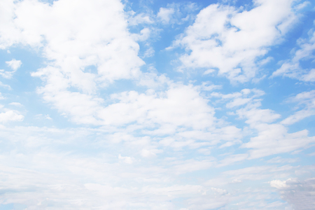 Blue sky background and white clouds soft focus, beautiful of nature.の写真素材