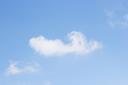 Blue sky background and white clouds soft focus, and empty space.の写真素材