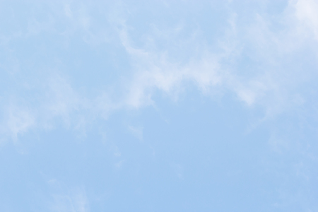 Blue sky background and white clouds soft focus, and empty space.の写真素材