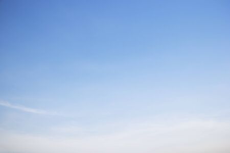 Soft white clouds against blue sky background and empty space.の写真素材