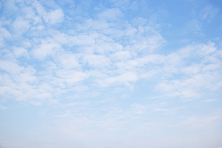 Blue sky background and white clouds soft focus.の写真素材
