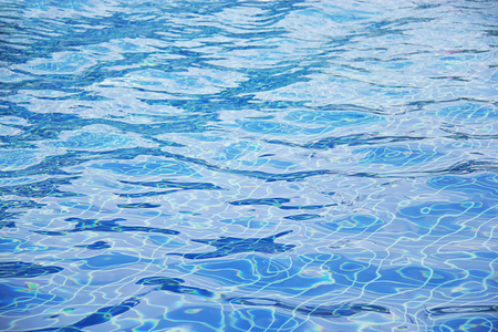 Abstract wave blue water in swimming pool for background.の写真素材