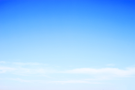 Blue sky background and white clouds soft focus, and empty space.の写真素材