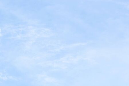 Blue sky background and white clouds soft focus, and copy-space.の写真素材