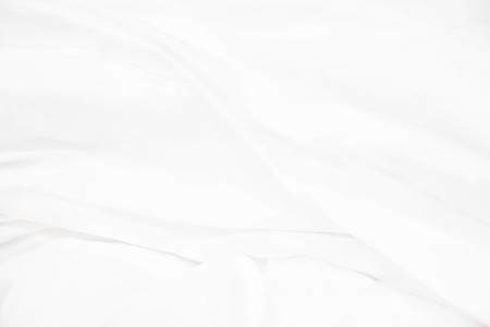 Close up of white bedding sheets and empty space.の写真素材