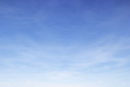Soft white clouds against blue sky background and copy space.の写真素材