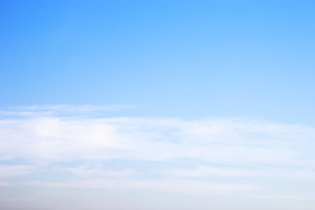 Blue sky background and white clouds soft focus, and empty space.の写真素材