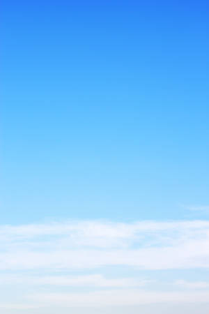 Blue sky background and white clouds soft focus, and empty space.の写真素材