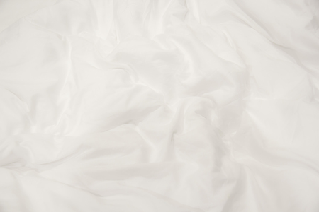 Close up of white bedding sheets soft focus and copy space.の写真素材