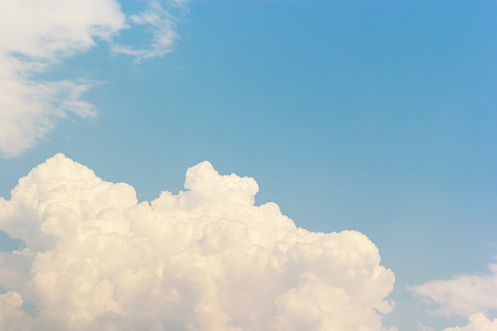 Blue sky background and white clouds soft focus, and copy space.の写真素材