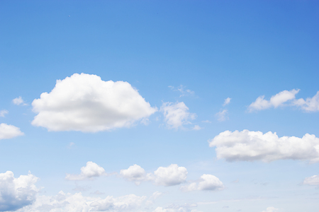 Blue sky background and white clouds soft focus, and copy space.の写真素材