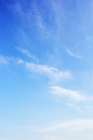 Blue sky background and white clouds soft focus, and copy space.の写真素材