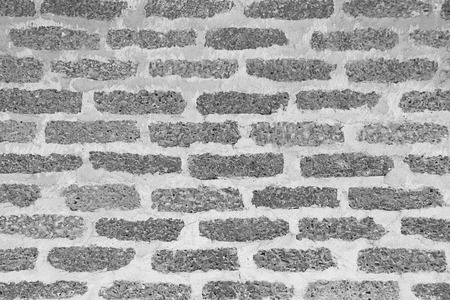 Gray brick wall as a background or texture and shadowの写真素材