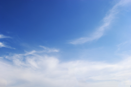 Blue sky background and white clouds soft focus, and copy space.の写真素材