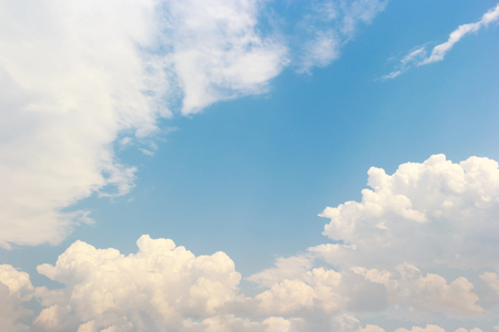 Blue sky background and white clouds soft focus, and copy space.の写真素材
