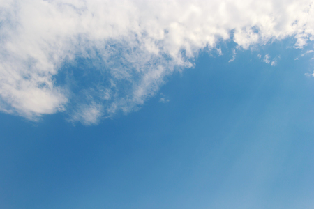 Soft white clouds against blue sky background and copy space.の写真素材