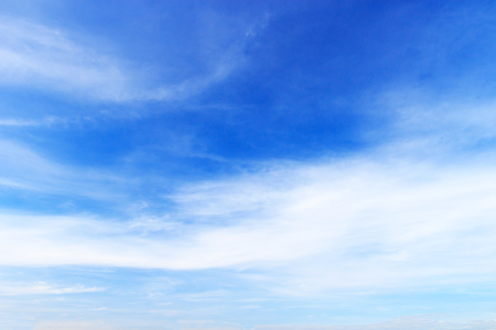 Blue sky background and white clouds soft focus, and copy space.の写真素材