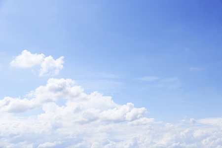 Blue sky background and white clouds soft focus, and copy space.の写真素材