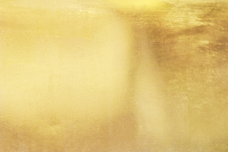 Gold abstract background or texture smooth and gradients shadow. Soft focus.の写真素材