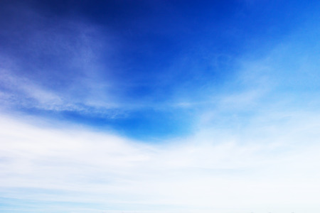 Blue sky background and white clouds soft focus, and copy space.の写真素材