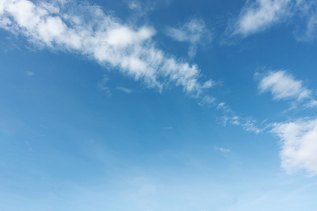 Blue sky background and white clouds soft focus, and copy space.の写真素材