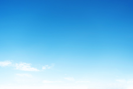 Blue sky background and white clouds soft focus, and copy space.の写真素材