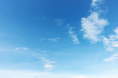 Blue sky background and white clouds soft focus, and copy space.の写真素材