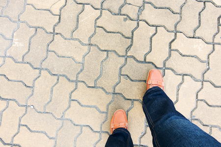 Female legs walking on walkway, top viewの写真素材