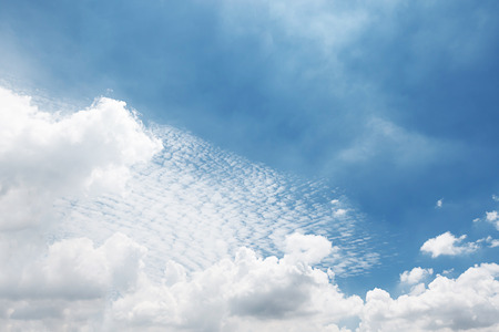 Blue sky background and white clouds soft focus, and copy space.の写真素材