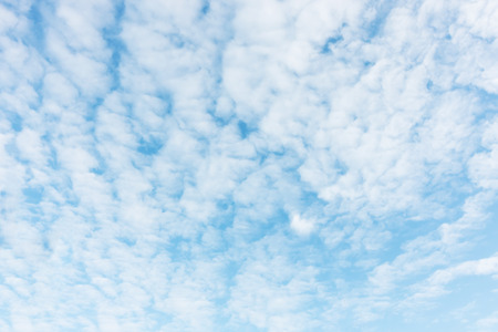 Fluffy blue sky background and white clouds soft focus, and copy space.の写真素材