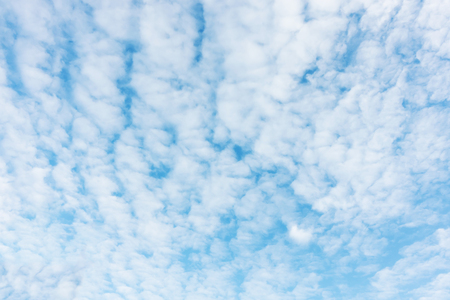 Blue sky background and white clouds soft focus, and copy space.の写真素材